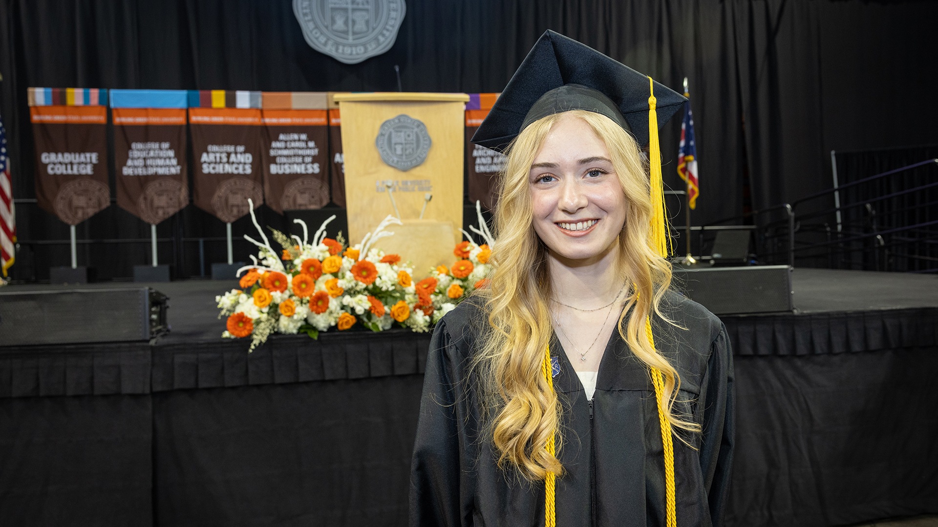 commence-9403 Woman poses for a picture after graduation
