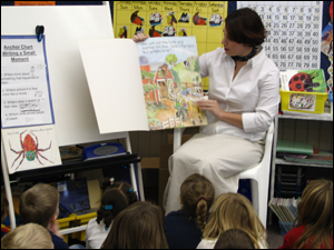 graduate reading to kids image